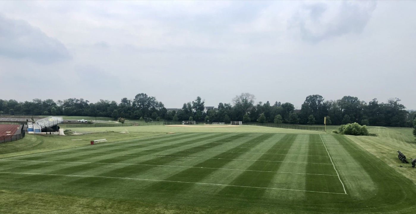 A finished sports turf field with new stripes installed by Blue Tree